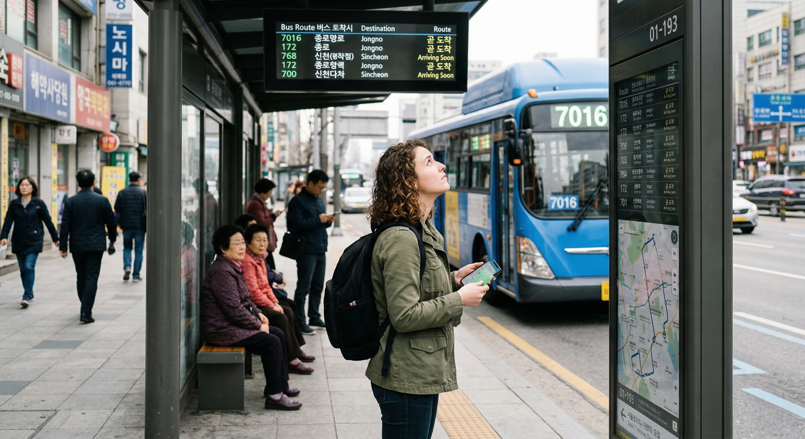 Foreign traveler checking route information at a Seoul bus stop as a city bus arrives